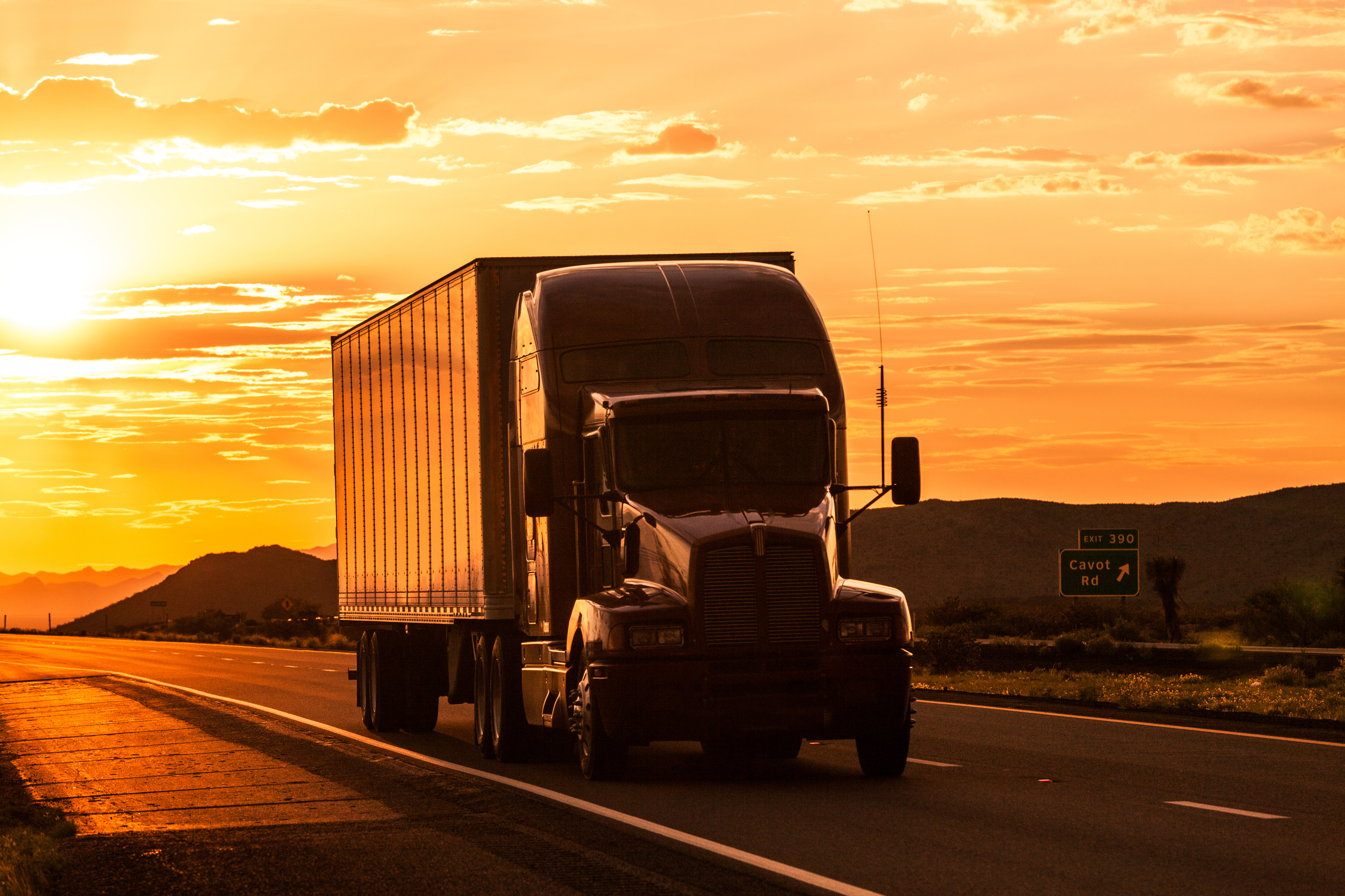 Truck on Highway at Sunset